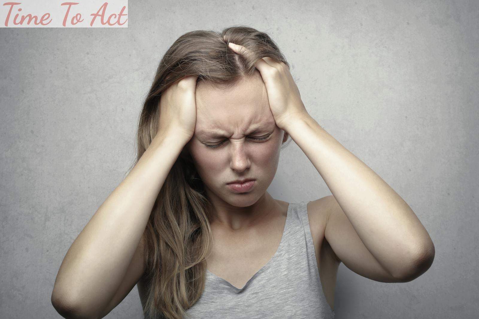 Woman in Gray Tank Top Showing Distress